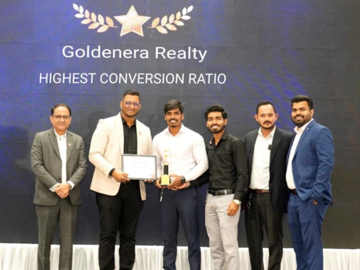 Goldenera Realty team on stage for Highest Conversion Ratio award
