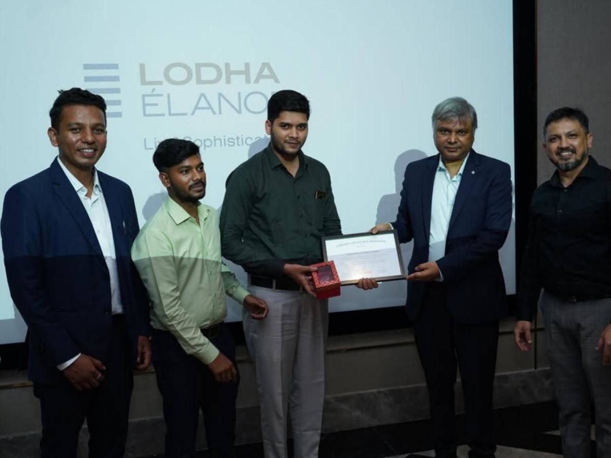 Golden Era Realty team receiving Lodha Elanor recognition on stage